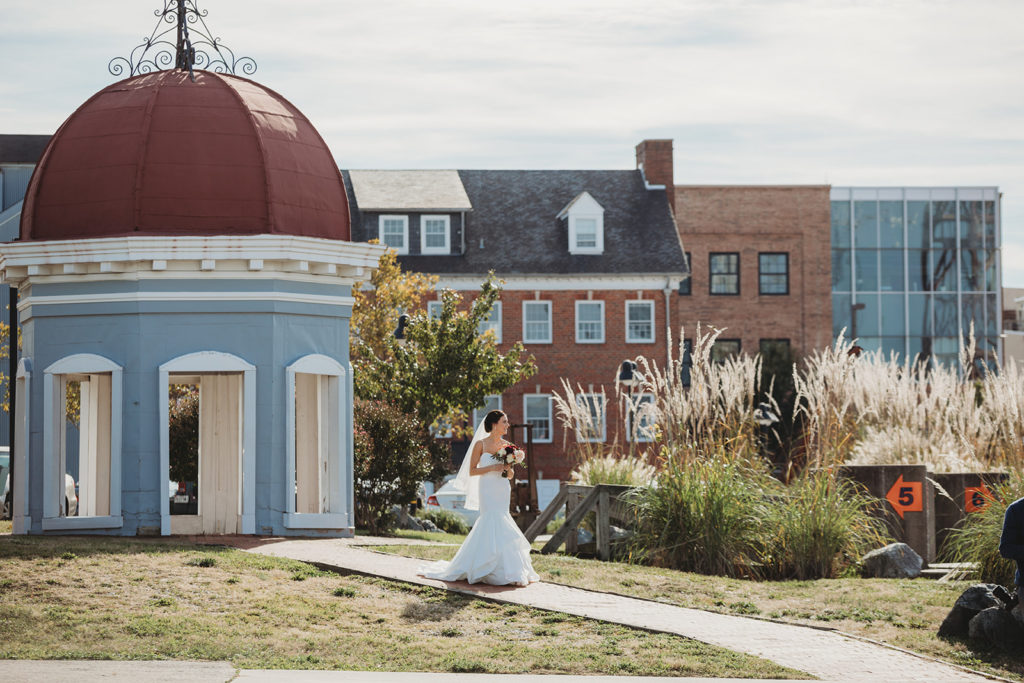 a bride walks in front of the baltimore museum of industry